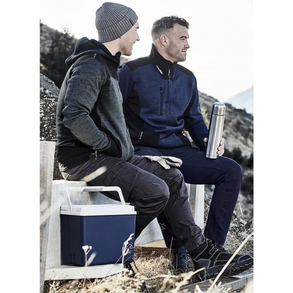 Two men sitting outdoors wearing unisex pullovers. One is in a grey and black pullover, the other in navy blue.