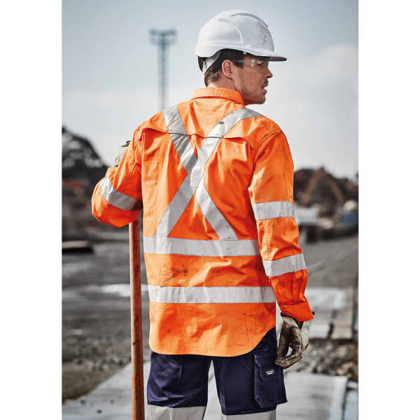 Hi-vis orange long sleeve work shirt with reflective tape detailing, worn by a man holding a pole, wearing a hard hat and safety glasses.