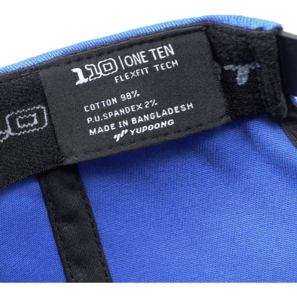 A blue cap featuring a flexible fit design, with a logo and care label inside. Made from cotton and spandex.