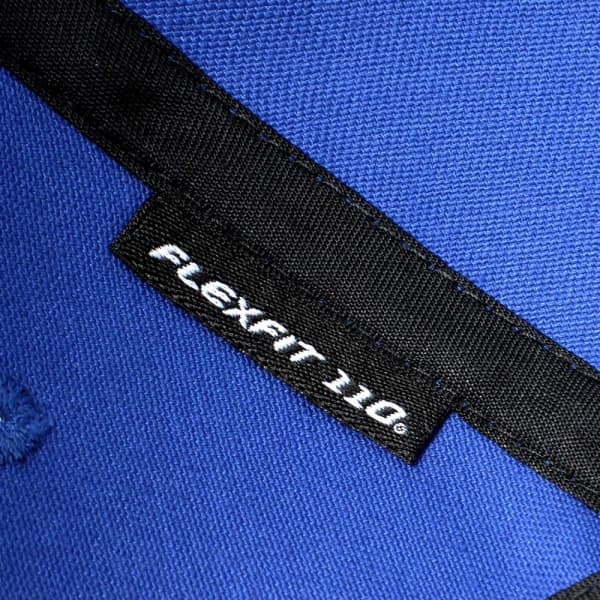 A blue cap featuring a flexible fit design and a branding label inside.