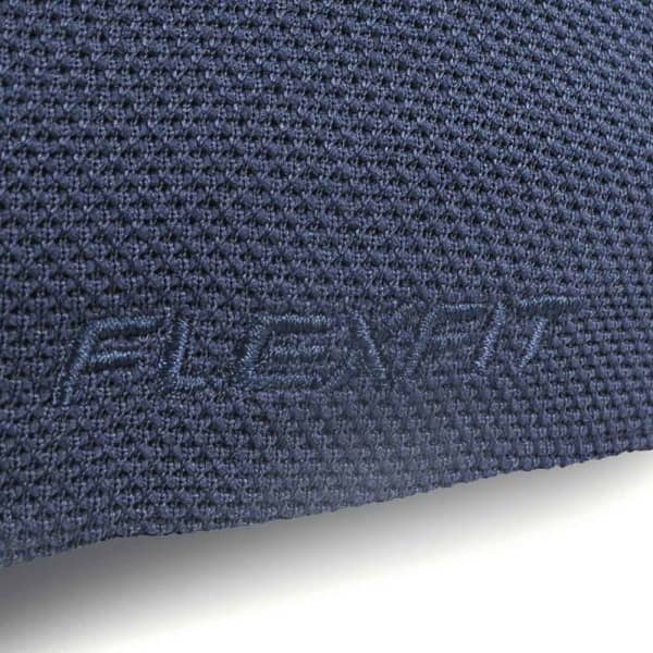 A textured navy cap featuring a subtle logo, designed for comfort and flexibility.