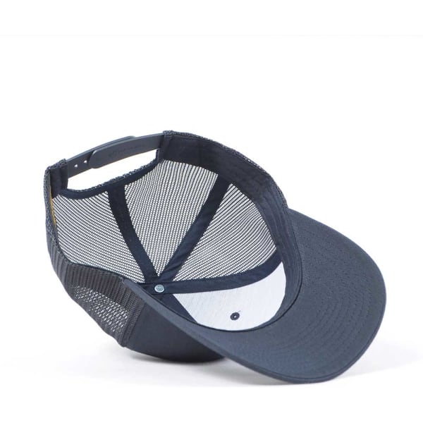 A navy trucker cap with a mesh back and a curved brim, featuring a logo on the front.