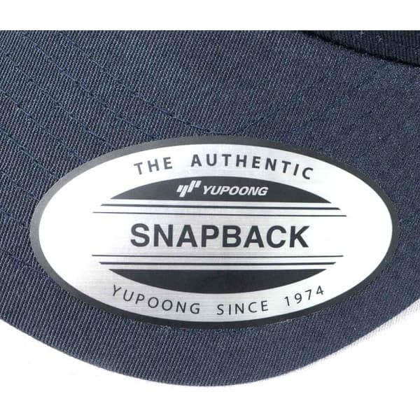A dark navy trucker cap featuring a logo sticker on the brim. The cap has a classic snapback style.