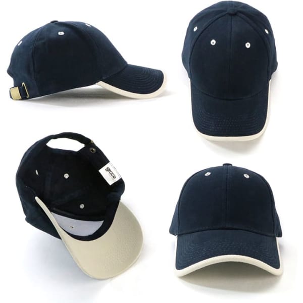  Navy cap with a cream brim and a branding tag, featuring stitched ventilation holes and an adjustable strap at the back.