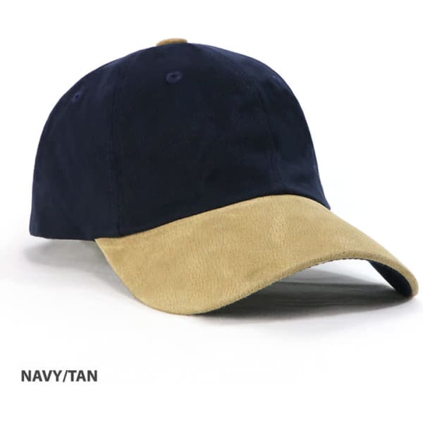 A navy and tan unstructured cap with a suede peak, featuring a logo on the front.