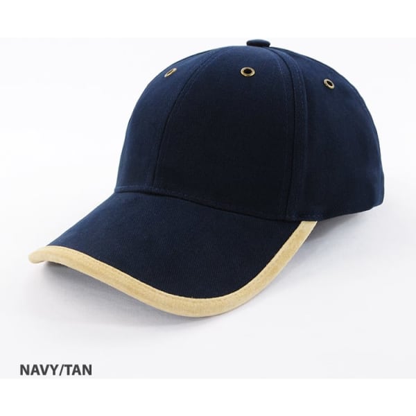 A navy and tan cap with a suede trim and six ventilation holes, featuring a logo on the front.