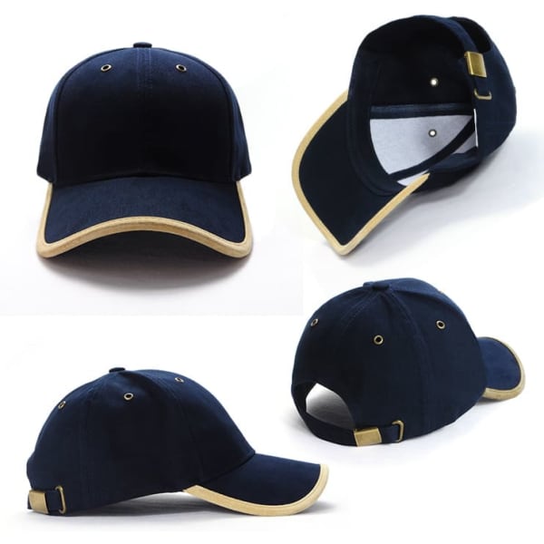 A navy blue cap with suede trim, featuring a logo and an adjustable strap at the back.