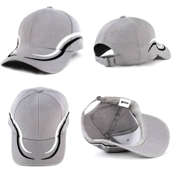 A grey cap with white and black detailing, featuring a curved design and a strap at the back. It has a logo.