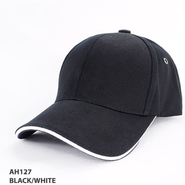 A black and white organic cotton sandwich cap with a curved brim, featuring a logo on the side.
