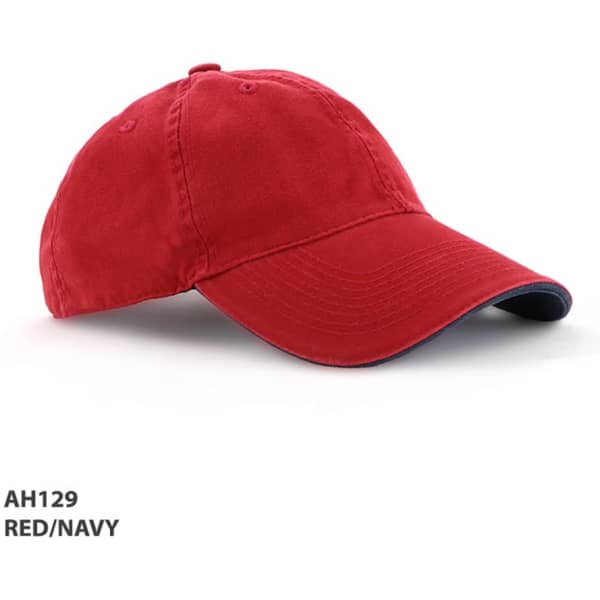 A red and navy enzyme washed cap with an adjustable strap and a curved brim. Features a logo on the front.