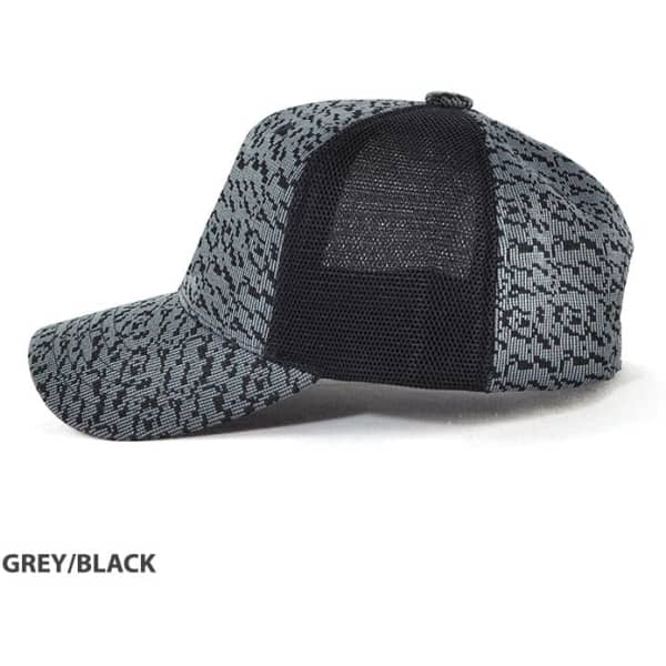 A grey and black cap with a mesh back and a patterned design, featuring a logo.