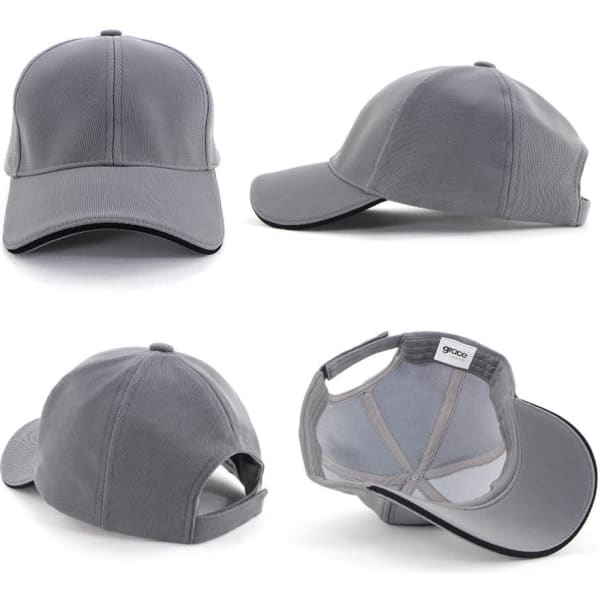 A grey mesh cap with a structured design, featuring a logo and an adjustable strap at the back.
