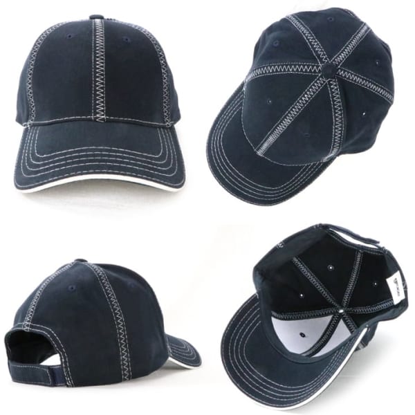 A navy blue cap featuring contrasting white stitching and a logo. The cap has a classic curved peak and adjustable strap.