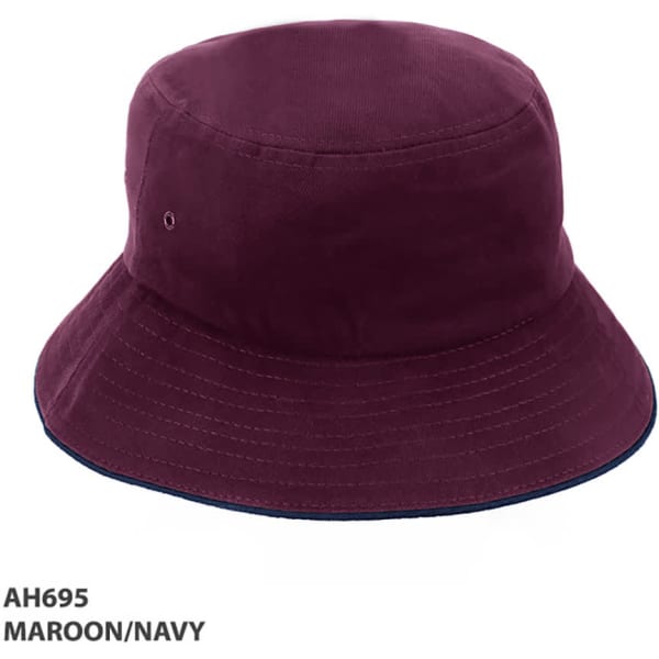 A maroon and navy bucket hat with a branding logo, featuring a wide brim and a classic design.