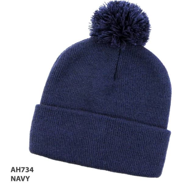 A navy beanie with a pom-pom on top and a folded cuff, featuring a logo.
