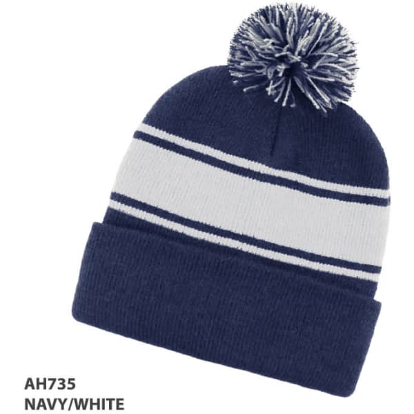 A navy and white beanie with a pom-pom on top and a stripe design. It features a logo on the side.