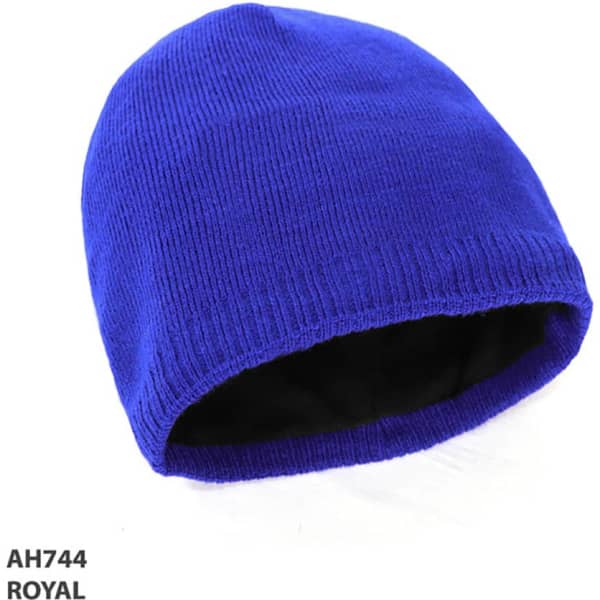 Acrylic beanie in royal blue with a black inner lining and a brand logo visible.