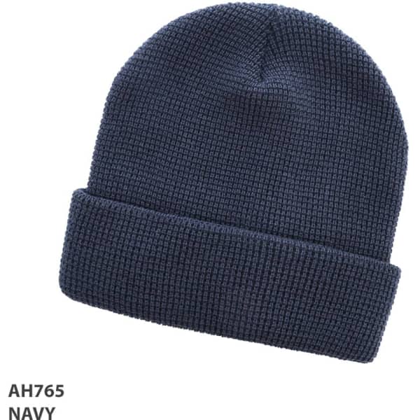 A navy grid knit beanie with a folded cuff and a textured pattern. It features a logo on the side.