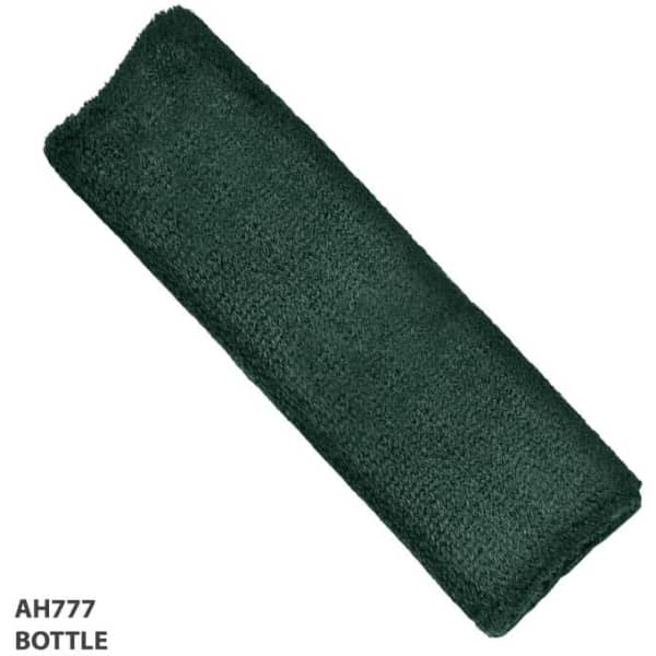 A dark green headband made from a soft, textured material. It features branding on one side.