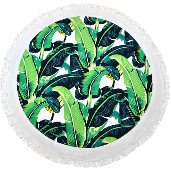 A round towel featuring a vibrant banana leaf pattern with fringed edges in shades of green and white.