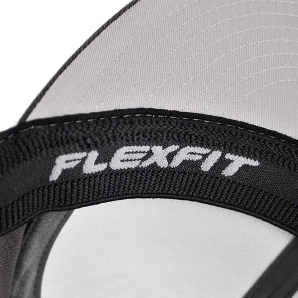 A close-up of a black cap featuring a FLEXFIT logo on the interior band. The cap has a grey lining.