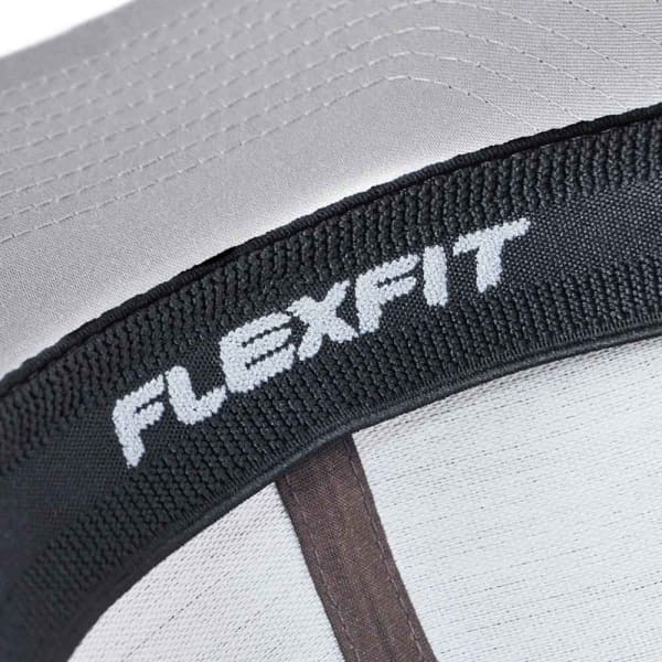 A close-up of a grey FLEXFIT trucker cap with a textured band and a logo on the interior.
