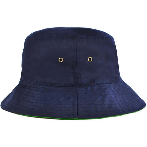 A reversible bucket hat in navy blue with green lining and metal eyelets for ventilation. It features a logo.
