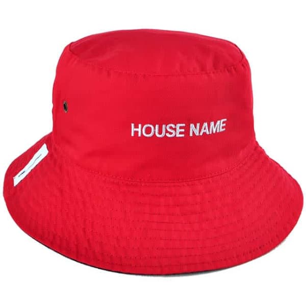 A reversible red bucket hat with an adjustable toggle and a logo on the side.