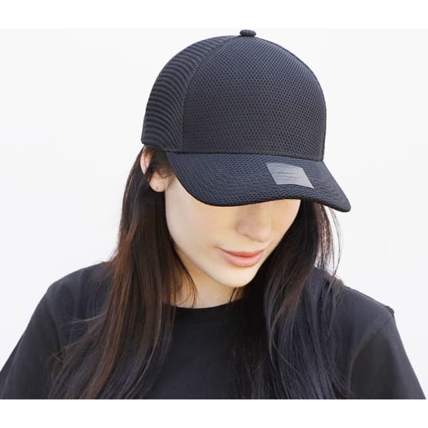 A black nylon and mesh cap with a structured design and a logo patch at the front.