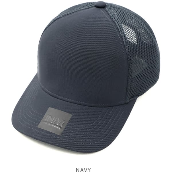 A navy cap made of polyester and mesh, featuring a logo on the front.