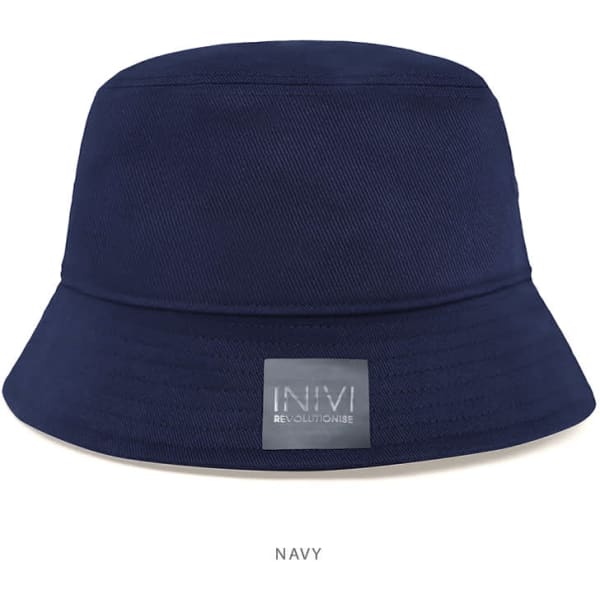 A navy bucket hat featuring a wide brim and a logo patch.
