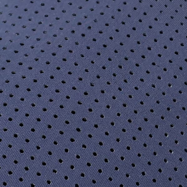 A navy premium nylon cap featuring a breathable perforated design and a logo.
