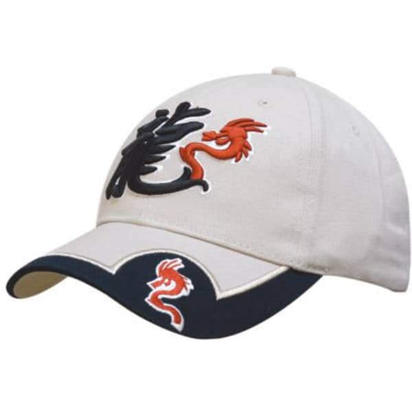 A beige baseball cap with embroidered dragon designs in black and orange, featuring a contrasting navy peak insert.