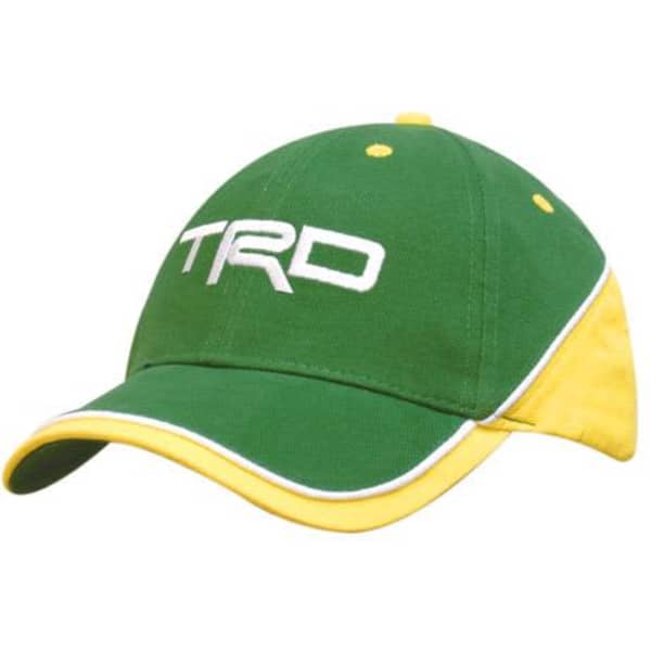 A green and yellow cap with contrasting panels and piping, featuring a logo on the front.