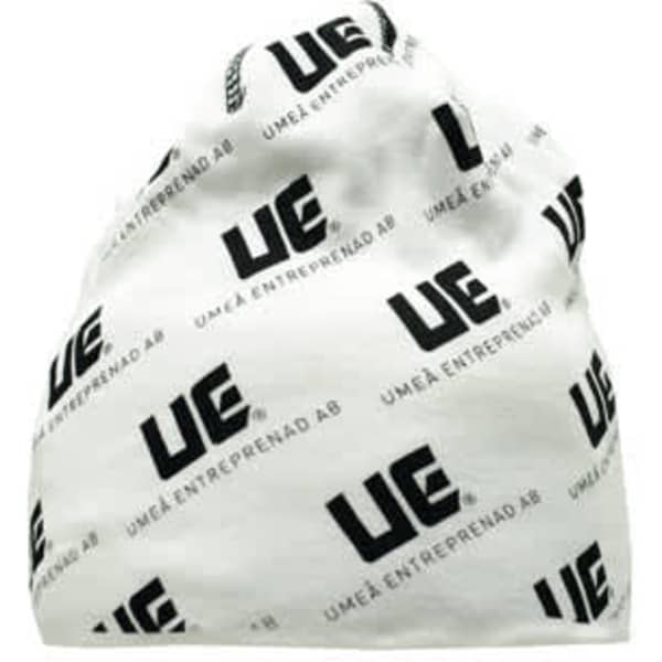 A white beanie featuring a repeated black logo pattern. The beanie has a soft, rounded top design.