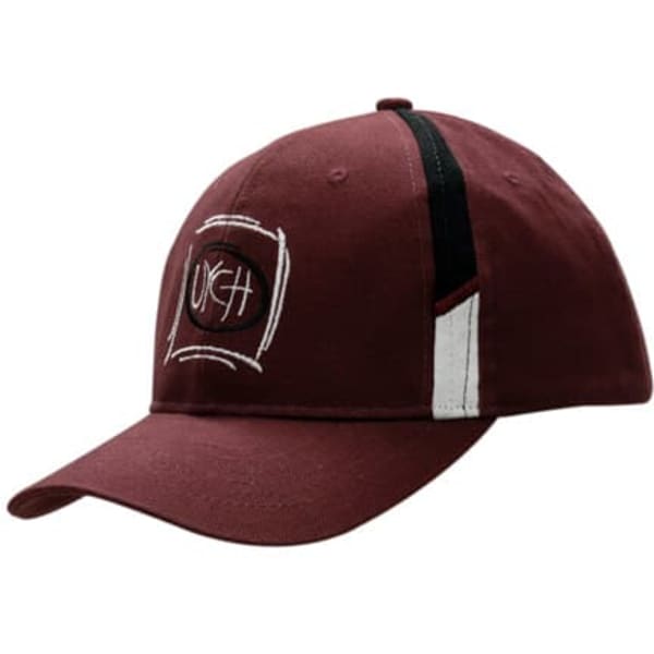 A maroon cap with a curved brim, featuring fabric inserts on the crown and a logo.