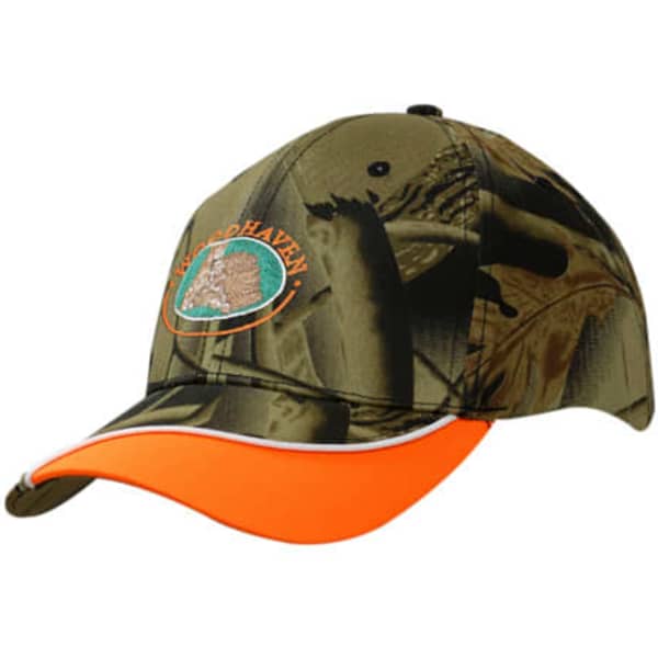 A cap in leaf camouflage with an orange peak and piping, featuring a logo on the front.