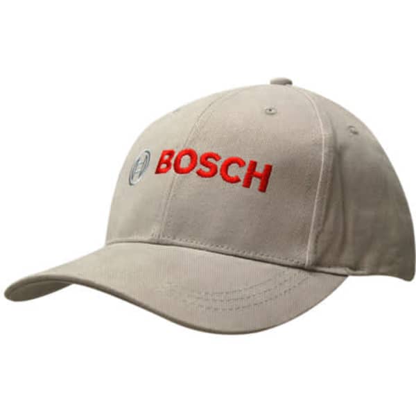 A beige cap featuring a contrasting peak and a logo on the front in red.