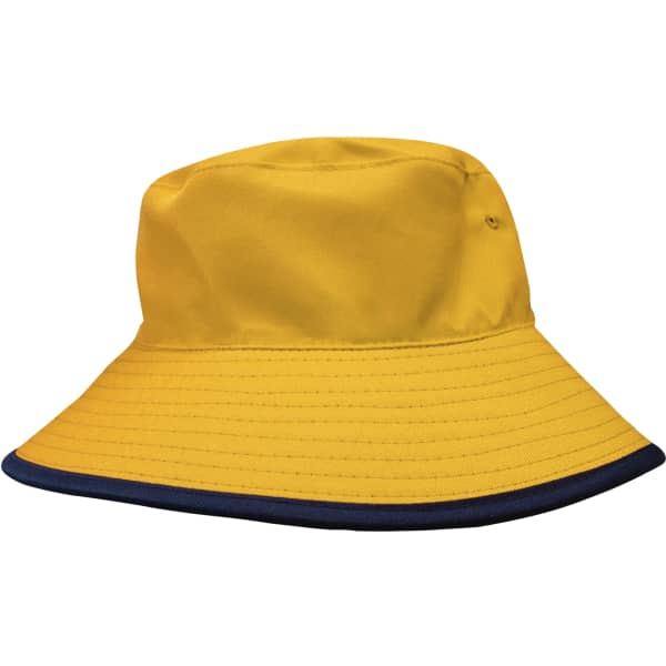 A reversible bucket hat in yellow with a navy blue brim and an attached branding logo.