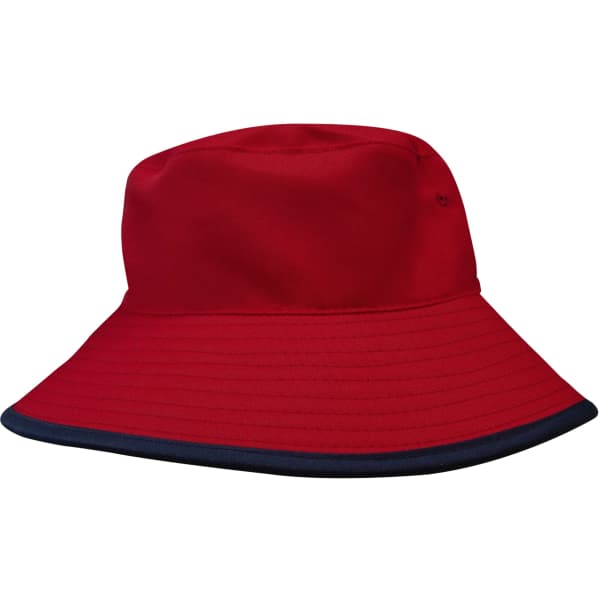 A red reversible bucket hat with a navy rim and a logo on the side. Made from breathable poly twill material.