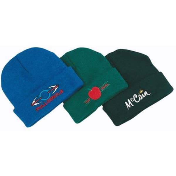 Three acrylic beanies in blue, green, and dark green, each featuring different logos.