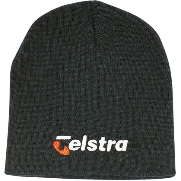 A rolled down black acrylic beanie featuring a logo on the front.