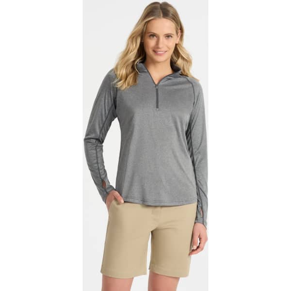 Grey long-sleeve zip-up top with a relaxed fit, paired with light beige shorts. The top features a logo on the front.