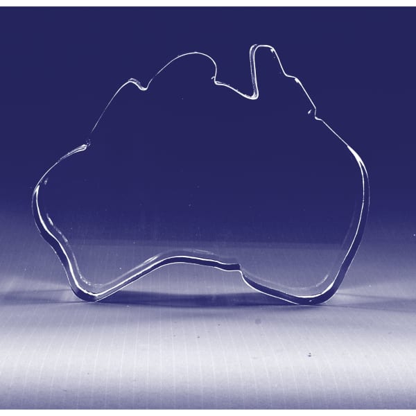 A clear 3D crystal in the shape of Australia, featuring smooth edges and a reflective surface.