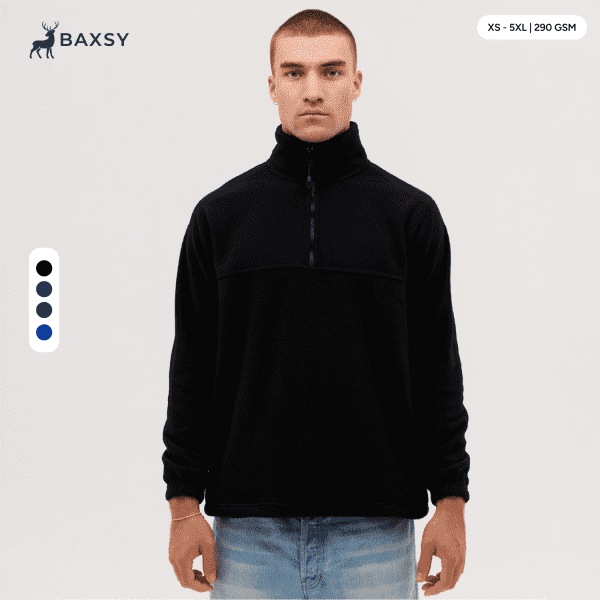 A black polar fleece 1/4 zip jacket displayed on a model, featuring a high collar and a logo.