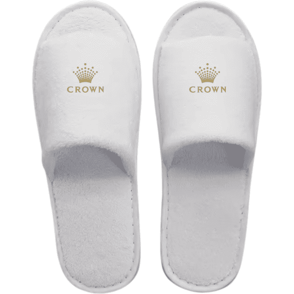 White open toe hotel slippers featuring a logo on the upper. Soft, plush material with a textured sole.
