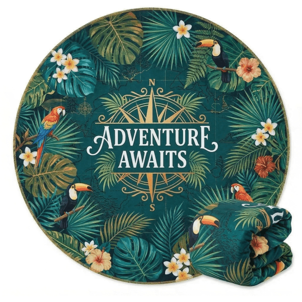 A round beach towel featuring a tropical design with green leaves, toucans, and flowers, folded beside it.