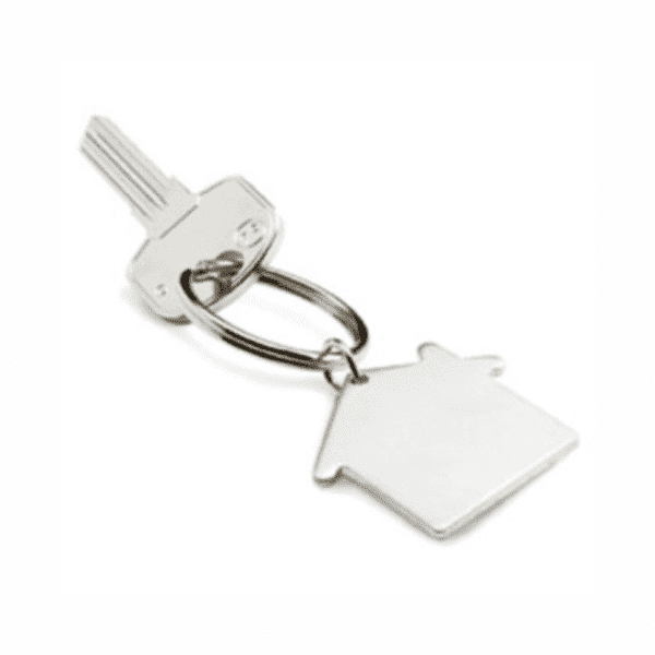 A silver key with a keyring shaped like a house. The key has a simple, sleek design.