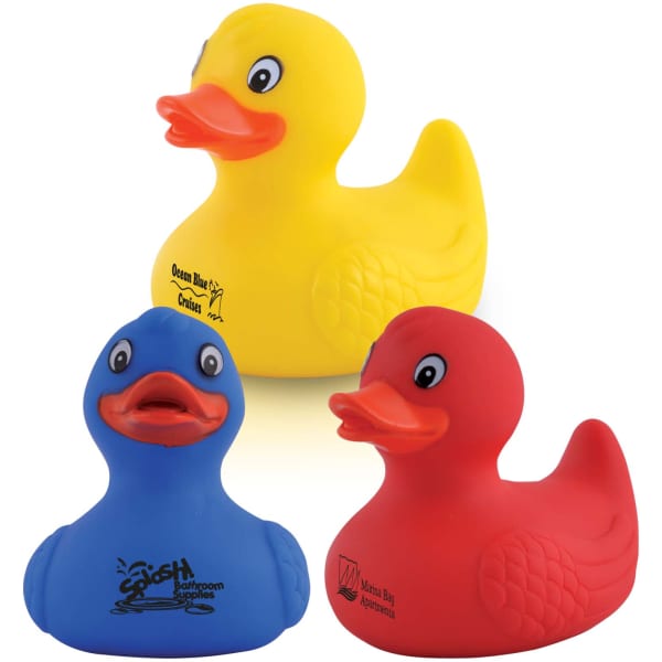 Three PVC bath ducks in yellow, blue, and red, featuring playful designs and logos.