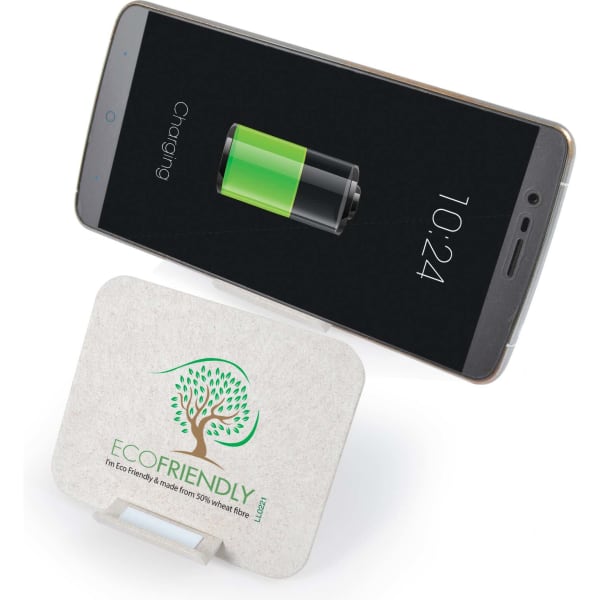 A wireless charger in a light colour with a logo, next to a smartphone displaying a charging battery icon.